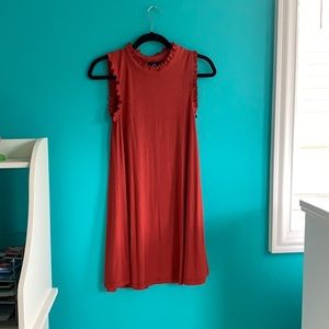 rust, dark orange shift dress with subtle ruffles